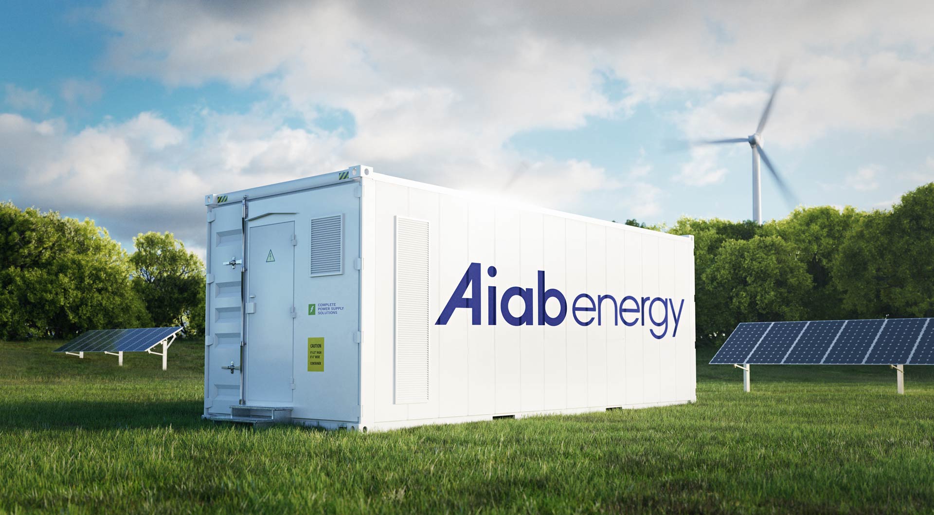 Aiab Energys BESS-container för energilagring med solpaneler och vindkraft i bakgrunden.